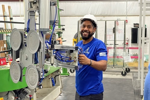 smiling worker in factory