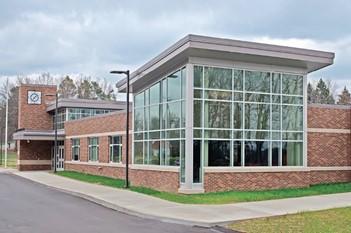 exterior of a brick and glass school building